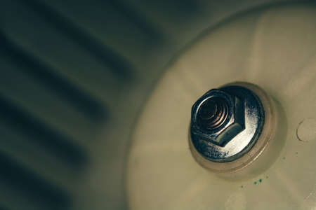 The nut holds the plastic surface on the stem. Vintage mechanism. Retro device.の写真素材