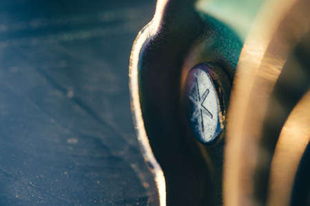 Part of the complex mechanism close-up on a background of a dirty glass.の写真素材