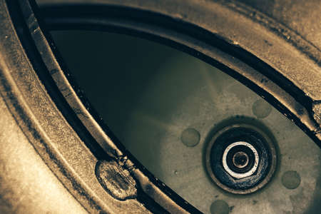 Unusual robotic eye in steampunk style. Focused robot look. Background pattern close-up.の写真素材