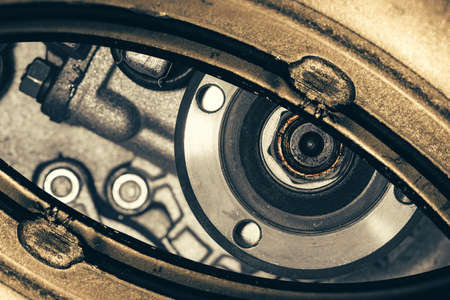 Unusual robotic eye in steampunk style. Focused robot look. Background pattern close-up.の写真素材