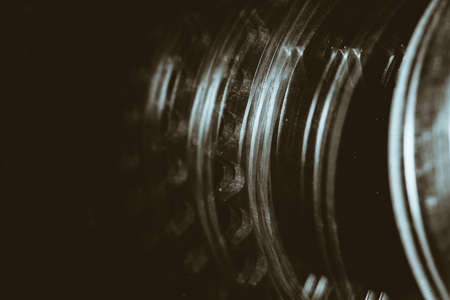 Monochrome multi exposition background of gear close up. Artwork from auto part in macro photography.の写真素材