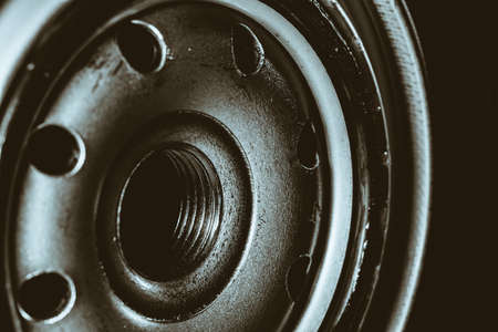 Monochrome background image of oil filter close up. Art macro photography of auto part.の写真素材