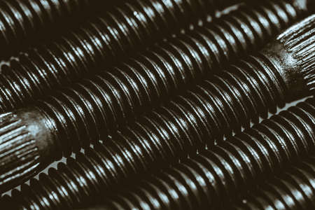 Monochrome background from automotive bolts close up.の写真素材
