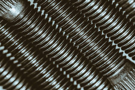 Monochrome background from automotive bolts close up.の写真素材
