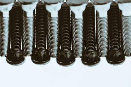 Monochrome artwork from automotive bolts close up.の写真素材