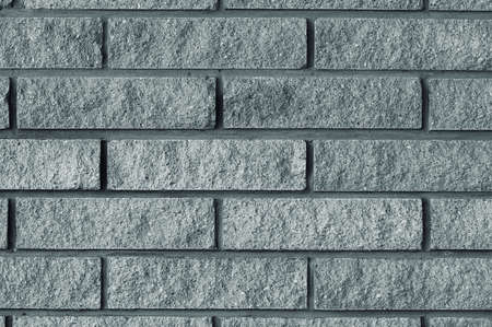 Decorative brick wall made of gray bricks.の写真素材