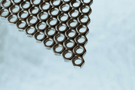Triangle from nuts on cyan background close up.の写真素材