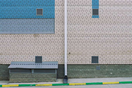 Wall of cooperative building for store, workshop, garage. Background from white brick wall with...