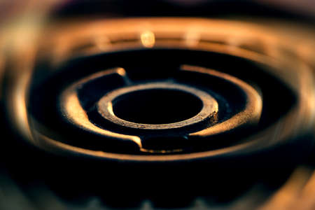 Part of complex mechanism is close-up.