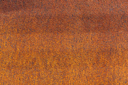 Rust on metallic surface. Rusted iron texture. Rusty metal background with copy space. Rough oxide...