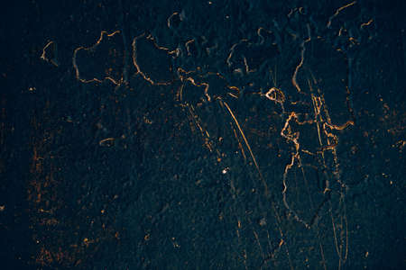 Blue golden vintage art background. Texture of decorative Venetian stucco. Sample. Gold magic book cover. Spotted scratched wall close-up. Backdrop of painted plaster in macro. Artwork textured plate.の写真素材