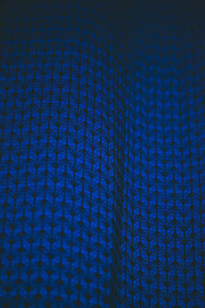 Amazing romantic night in window behind silhouettes of tulle texture. Wonderful dark blue sky nightly from window through patterned curtain. Cosiness shadow night background. Copy space.の写真素材