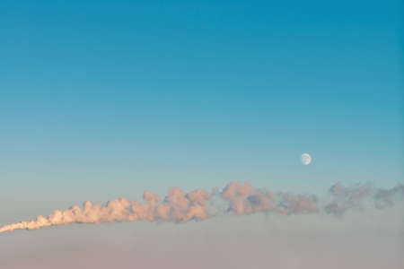 Horizontal thick smoke from smokestack in sky. Dense smog in atmosphere on moon background with copy...