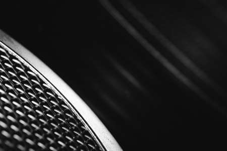 Futuristic object with a metallic weave, and its reflection in the glass.の写真素材