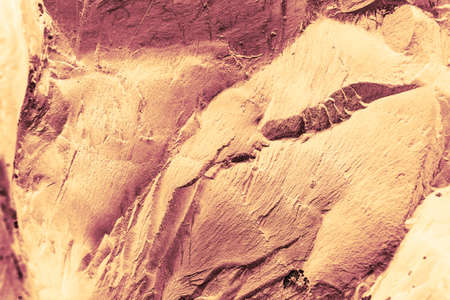 Vintage yellow background. Rough painted wall of aspen gold color. Imperfect plane of golden...