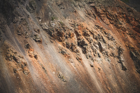 Nature background of big beautiful rocky mountain surface close-up. Natural backdrop of giant craggy...