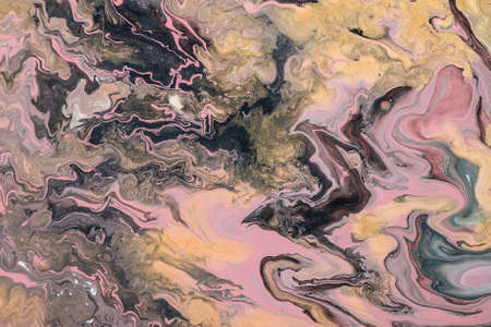 Fantasy fluid art background with mix of pink golden and black tints and random image of black raven. Dirty effect of acrylic paints. Liquid ink texture. Random abstract image of dragon, bat or crow.の写真素材