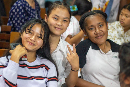 Muntilan, Indonesia - 18 Mar 2026: Portrait of three happy young Indonesian female students smiling...