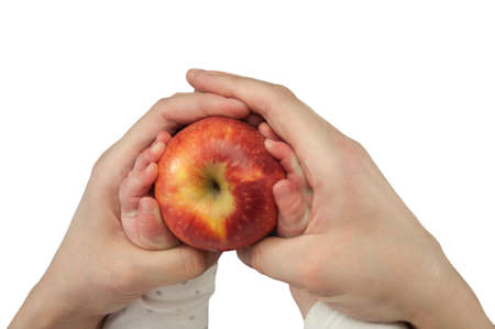 Young woman and little child holding apple on color background, top view. Healthy dietの写真素材