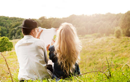 beautiful pregnant girl with a young guy are happy to findの写真素材