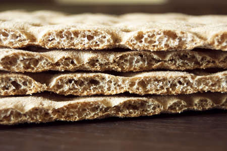 four brown cracker over wood background, dietの写真素材