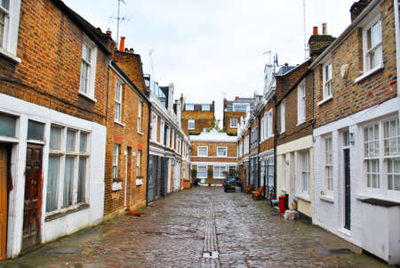 LONDON - JANUARY 24: Mews is a primarily British term formerly describing a row of stables, usually with carriage houses below and living quarters above. January, 24, 2016 in London, England.のeditorial素材
