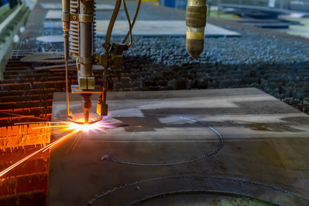 Gas cutting of sheet steel on a machine with numerical control. Splashes of molten metal. high...