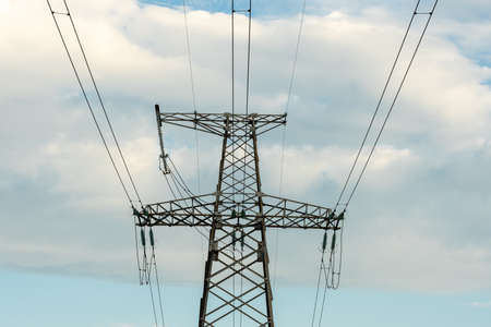 High voltage power lines. Transmission of electricity by means of poles through agricultural land....