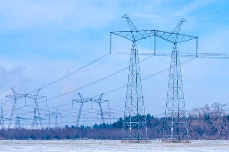 Power lines over agricultural fields covered with snow. high quality photoの写真素材
