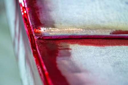 Detection of minor defects after the end of welding work. Testing of welded joints with a penetrating liquid. high quality photoの写真素材