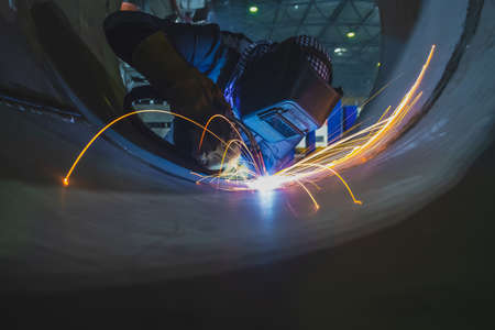 Welding of stainless steel pipes. Semi-automatic arc welding. MIG welding. high quality photo