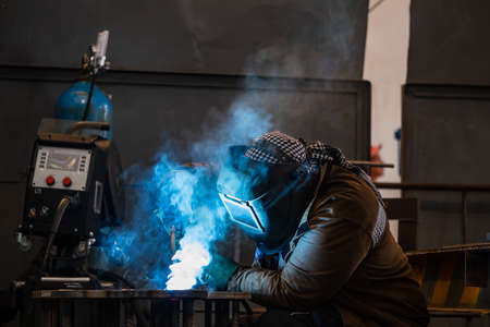 Welding of metal structures by semi-automatic arc welding. MIG welding. high quality photo