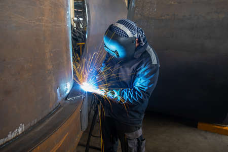 Welding of metal structures by semi-automatic arc welding. MIG welding. high quality photo