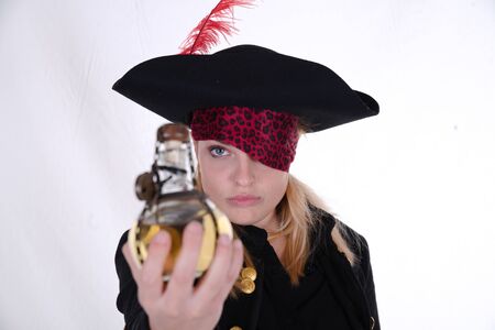 carribean girl pirate in the black background look the cameraの写真素材