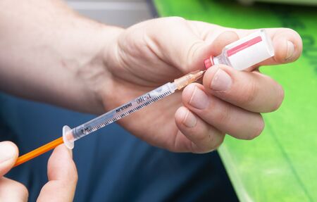 veterinary take vaccine in the syringeの写真素材