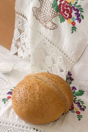 Bread and salt on an embroidered towel.の写真素材