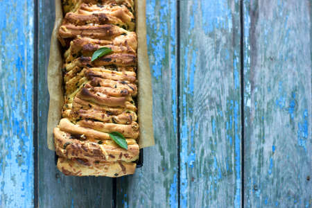 Homemade bread with cheese, salami and herbsの写真素材