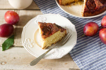 Plum pie or cake with cinnamon and sugar. Plum cake from the newspaper New York Times . Selective focus.の写真素材