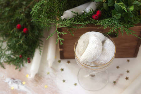 Christmas cookies vanilla crescents in festive decoration. Rustic style, selective focus.の写真素材