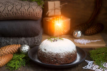 Christmas cake or pudding in festive decoration. Selective focus.の写真素材