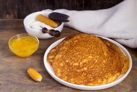 Coconut corn pancakes with honey. Rustic style.の写真素材
