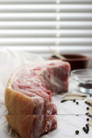 Raw fat pork belly on white paper.の写真素材