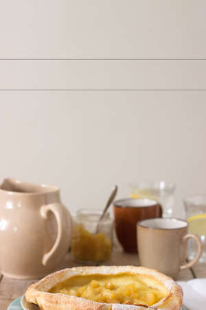 Dutch baby pancake with apple-cinnamon sauce. Selective focus.の写真素材