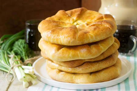 Traditional homemade Romanian and Moldovan pies - Placinta, served with wine. Rustic style, selective focus.の写真素材
