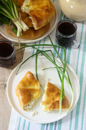 Traditional homemade Romanian and Moldovan pies - Placinta, served with wine. Rustic style, selective focus.の写真素材