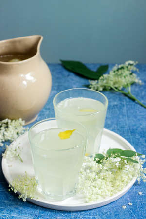 Cold sokata - a traditional Romanian drink made from the flowers of elder and lemon, produced by fermentation. Selective focus.の写真素材
