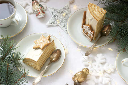 Homemade honey cake with sour cream, decorated with gingerbread. Rustic style, festive decoration.