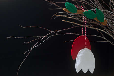Spring symbol Martenitsa or martisor consisting of red and white pieces, traditional for Romania,...