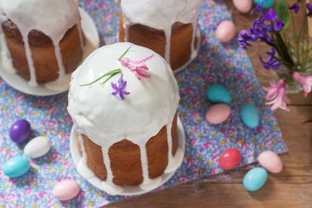 Traditional homemade Easter cake in the Easter decoration. Rustic style, selective focus.