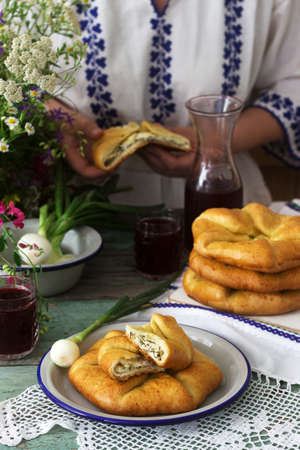 Traditional homemade Romanian and Moldovan pies - Placinta, served with wine. Rustic style.の写真素材